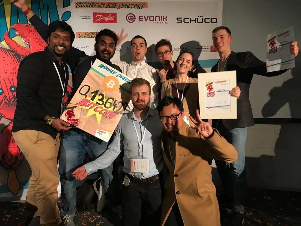 The winning team at the Energy Efficiency Hack 2018 holding the Winner Overall sign and trophy.